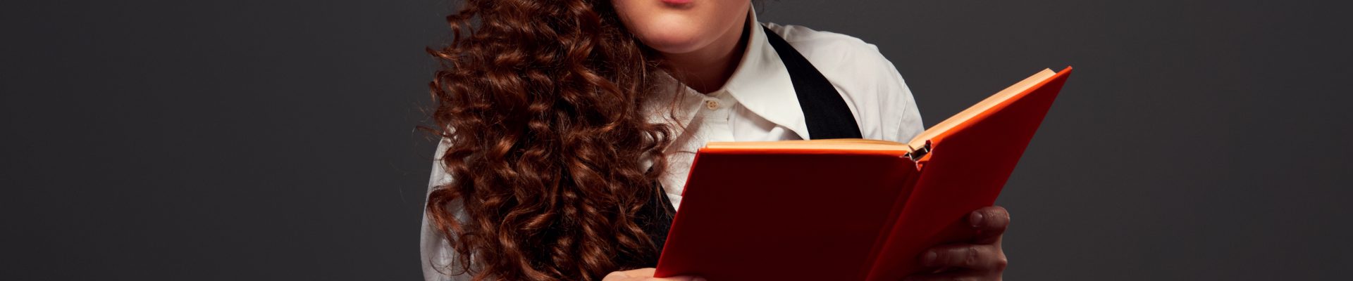 it is impossible to understand funny woman with book can't understand her lessons. picture over dark background